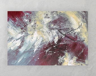 May include: Abstract painting with shades of red, white, and gold. The painting is hanging on a gray wall above a blue sofa and a blue armchair.
