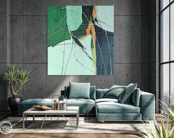 May include: A teal sectional sofa with two pillows in a modern living room with a large abstract painting on the wall. The painting features green, blue, and orange colors.