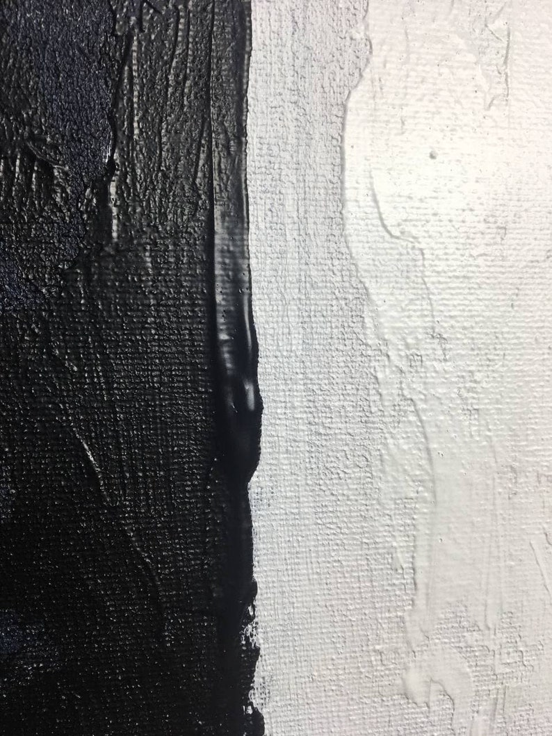 May include: Abstract painting with a vertical line dividing the canvas. The left side is painted in black with a textured brushstroke. The right side is painted in white with a smooth brushstroke.