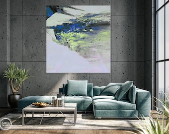 May include: Abstract painting in shades of blue, green, and white, hanging on a wall in a modern living room with a teal sectional sofa and a coffee table.