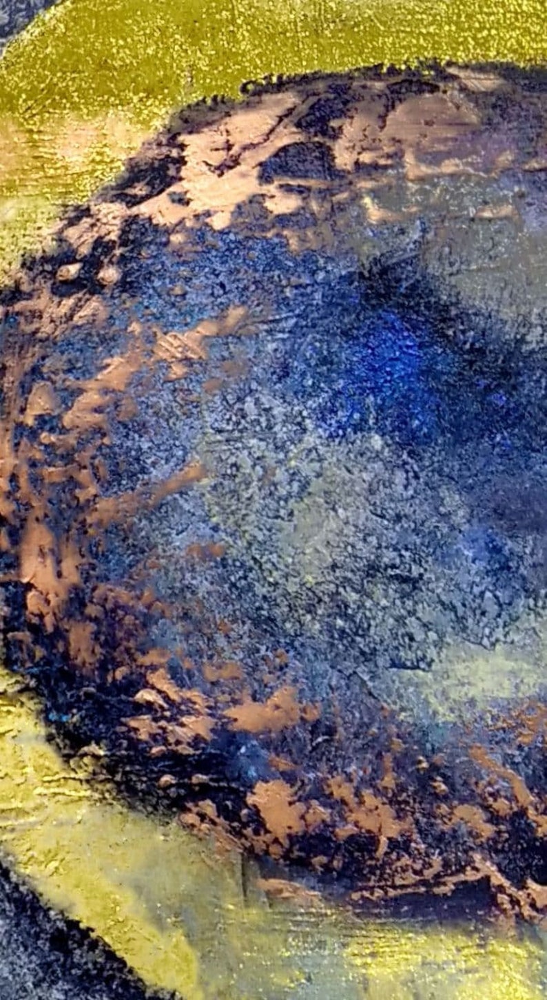 May include: Abstract painting with a textured, circular shape in shades of blue, brown, and gold. The circular shape is surrounded by a golden background.
