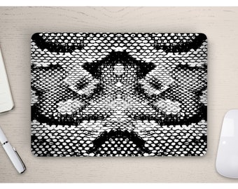 May include: Black and white laptop skin with a snakeskin pattern.