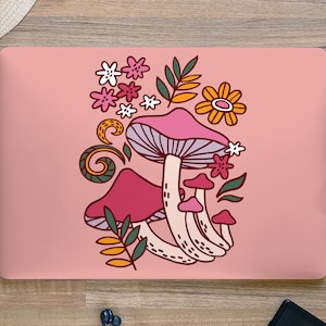 May include: Pink and white mushroom illustration with floral accents on a pink background. The mushrooms have a whimsical, cartoon-like style.