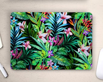 May include: A laptop skin with a tropical print featuring vibrant green, blue, pink, and purple flowers and leaves on a black background.