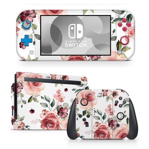 May include: A floral patterned skin for the Nintendo Switch Lite console. The skin features pink and white roses, green leaves, and a white background. The skin is designed to fit the console, the Joy-Con controllers, and the dock.
