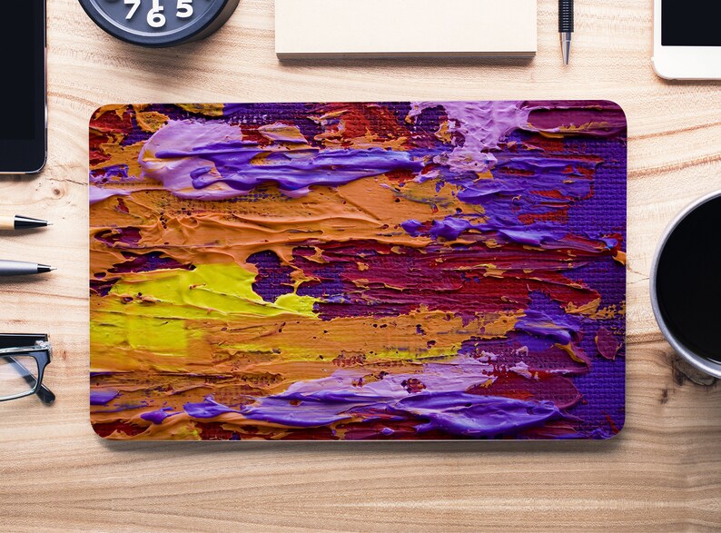 May include: Abstract painting with thick brushstrokes in shades of purple, yellow, orange, and red. The painting has a textured surface and a modern style.