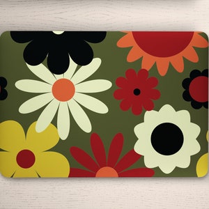 May include: A laptop skin with a retro floral pattern featuring large, colorful flowers in shades of red, orange, yellow, green, and black on a dark green background.