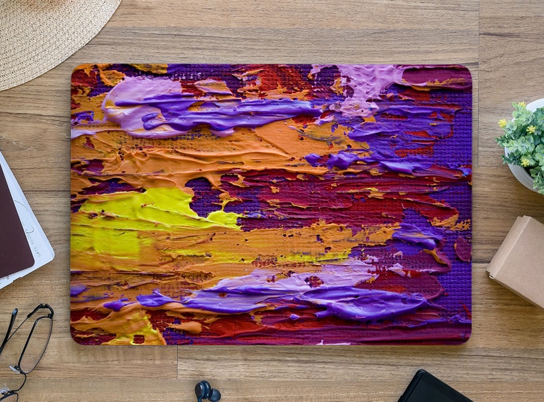 May include: Abstract painting with thick layers of purple, yellow, orange, and red paint. The paint is applied in a textured, brushstroke style.