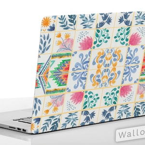 May include: A laptop skin with a colourful tile pattern featuring blue, green, yellow, orange, and pink watercolour designs. The skin is designed to fit a laptop and has the text "Laptop Skins" and "Wallooks" on the bottom.