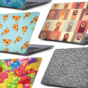 May include: Five different laptop skins with various designs. The designs include pizza slices, paw prints, sweets, and a maze pattern.