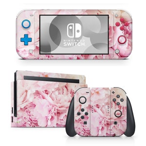 May include: Pink floral Nintendo Switch console skin with a pink and white floral design. The skin covers the console, the Joy-Con controllers, and the dock.