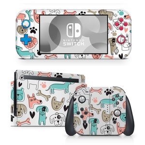 Op de afbeelding: Een witte Nintendo Switch Lite console skin met een schattig hondenpatroon. De skin heeft verschillende honden in verschillende poses, samen met poot afdrukken, harten en botten. De skin is ontworpen om te passen op de Nintendo Switch Lite console en bevat een bijpassende skin voor de Joy-Cons.