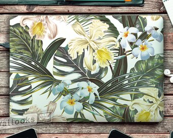 May include: A laptop skin with a tropical floral design featuring white, yellow, and blue flowers with green leaves on a white background.