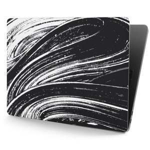 May include: Black and white laptop skin with a swirling abstract pattern. The pattern is made up of white lines on a black background.