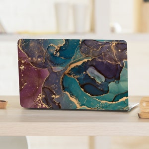 May include: A laptop computer with a teal, purple, and gold abstract marble design on the lid.