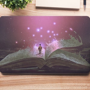 May include: A person standing on a large open book with pages that are curled and flowing. The book is surrounded by a pink and purple glow with small white lights.