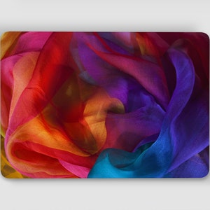 May include: A colorful abstract design featuring a vibrant mix of red, orange, yellow, blue, and purple fabric. The fabric is draped and folded, creating a dynamic and textured pattern.