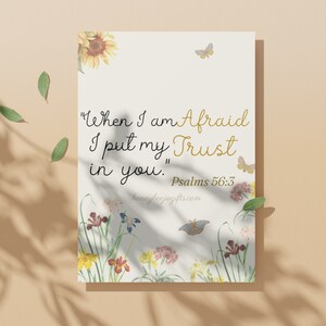 May include: A white card with a floral design and the quote "When I am Afraid I put my Trust in you." Psalms 56:3. The card is on a beige background.