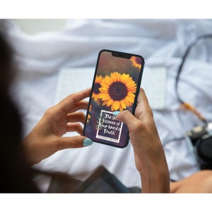 May include: A smartphone displaying a sunflower image with the text "The Very Essence of Your Word is Truth" and the scripture reference "Psalms 119:160".