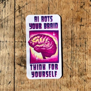 May include: A rectangular sticker with the text "AI ROTS YOUR BRAIN" above a pink brain illustration. Below the brain is the text "THINK FOR YOURSELF". The sticker has a white background and a purple border.