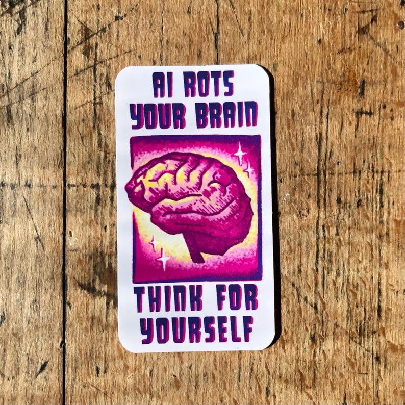 May include: A rectangular sticker with the text "AI ROTS YOUR BRAIN" above a pink brain illustration. Below the brain is the text "THINK FOR YOURSELF". The sticker has a white background and a purple border.
