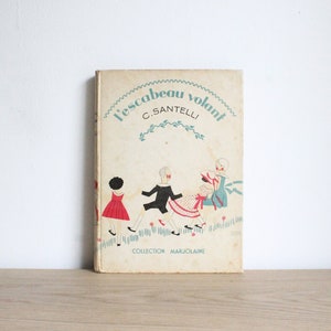 Livre pour enfants à couverture rigide de César Santelli, millésime 1935, L'Escabeau Volant