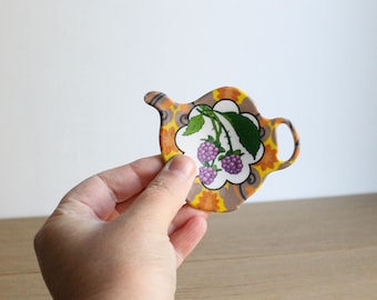 Posavasos vintage de plástico de los años 90 con bolsitas de té y decoración de mora, melamina francesa Siléa.
