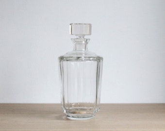 Vintage mid century liquor and whiskey decanter with blemishes, thick and heavy faceted cut glass