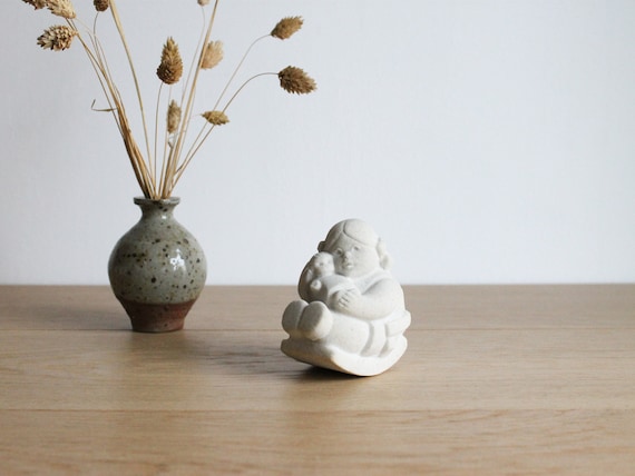 Vintage Marbell Stone Art Belgium, figurine of a child on a rocking chair