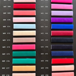 May include: A color chart with 22 fabric swatches. The swatches are arranged in two columns, with the numbers MY 164 through MY 179 on the left and MY 180 through MY 195 on the right. The swatches are a variety of colors, including purple, blue, pink, red, green, and yellow.