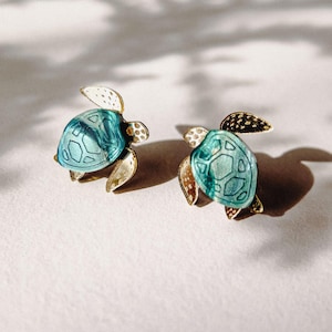 Oorknopjes kleine zeeschildpad van acrylglas