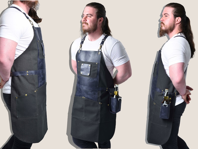 May include: A black and blue apron with multiple pockets and leather accents. The apron has a neck strap and waist straps. A small pocket on the side holds a bottle and a bottle opener. The apron is designed for utility.