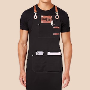 Custom logo apron for men and women with personalized embroidery name tags. Cotton canvas with cross-back leather straps and towel ring.