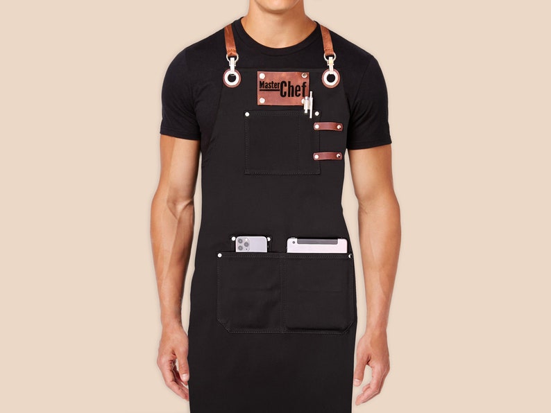 Custom logo apron for men and women with personalized embroidery name tags. Cotton canvas with cross-back leather straps and towel ring. image 1