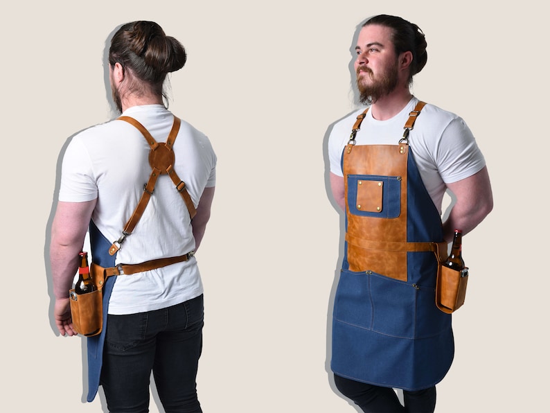 May include: A blue and brown apron with a leather chest pocket and a bottle holder. The apron has adjustable straps and a waist belt. The apron is designed for bartenders or servers.