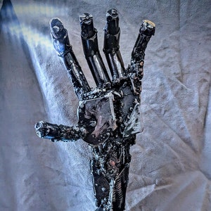 Life sized metal hand sculpture