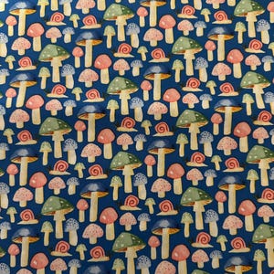 May include: A repeating pattern of colorful mushrooms and snails on a dark blue background. The mushrooms have various cap colors, including pink, green, and blue. The snails are small and red. The overall design is whimsical and nature-themed.