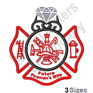May include: Red and black firefighter's emblem with a diamond ring on top. The emblem has a ladder, axe, hose, and helmet. The text below the emblem reads "Future Fireman's Wife".
