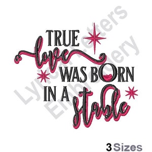 May include: Black and pink embroidery design with the text "True love was born in a stable" and a star.