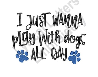 May include: Black and white text on a white background that reads "I just wanna play with dogs all day". Two blue paw prints are on either side of the text.
