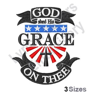 May include: Embroidered design with a black banner that reads "God shed His Grace on Thee". The banner is decorated with a red and white cross and a blue and white star pattern.