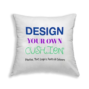 May include: White square cushion with the text "DESIGN YOUR OWN CUSHION" in blue, purple, and green. The text below reads "Photos, Text, Logo's, Fonts & Colours".