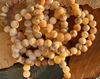 Orange calcite crystal bead bracelet 12mm stretchy