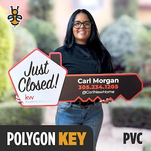 May include: A white and red house-shaped sign with the text "Just Closed!" and the Keller Williams Realty logo. A black and red key-shaped sign displays contact information for Carl Morgan. The sign is labeled "Polygon Key" and "PVC".