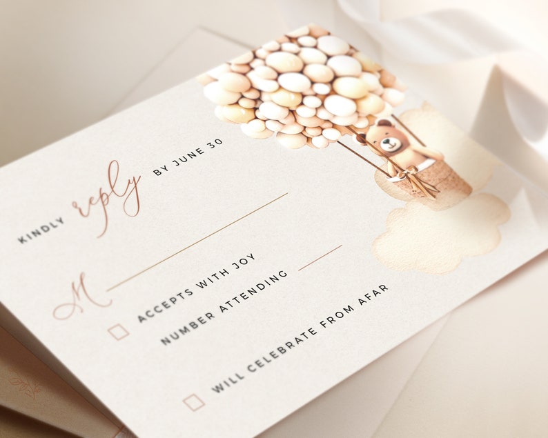 May include: A white RSVP card with a brown teddy bear holding onto a bunch of balloons. The card has the text "KINDLY reply BY JUNE 30" and a checkbox for "ACCEPTS WITH JOY" and "WILL CELEBRATE FROM AFAR".