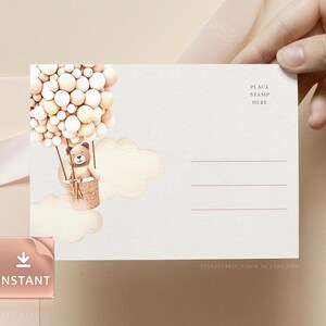 May include: A white postcard with a brown teddy bear in a hot air balloon made of cream and white balloons. The postcard has a place to put a stamp and a space for an address. The text "DIYPAPERSBOUTIQUE on ETSY.COM" is at the bottom of the postcard.