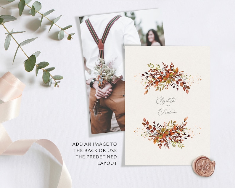 May include: A wedding invitation with a watercolor design of fall leaves in shades of orange, red, and green. The text "Elizabeth and Christian" is written in a cursive font.