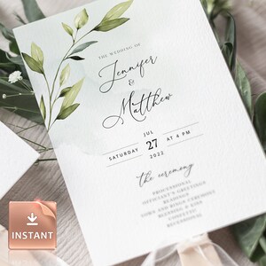 May include: A wedding ceremony programme with a watercolour design of green leaves on a light blue background. The programme includes the names Jennifer and Matthew, the date 27 July 2022, and the time 4 PM. The text "The Ceremony" is written in a script font.