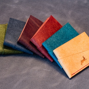 Othus Twist Wallet - handgefertigte minimalistische Lederwickelgeldbörse