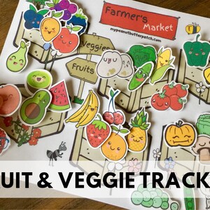 May include: A colourful printable fruit and veggie tracker with a farmer's market theme. The tracker features cute cartoon illustrations of fruits and vegetables, including apples, bananas, strawberries, avocados, and peppers. The text "Farmer's Market" and "Fruit & Veggie Tracker" are visible on the printable.